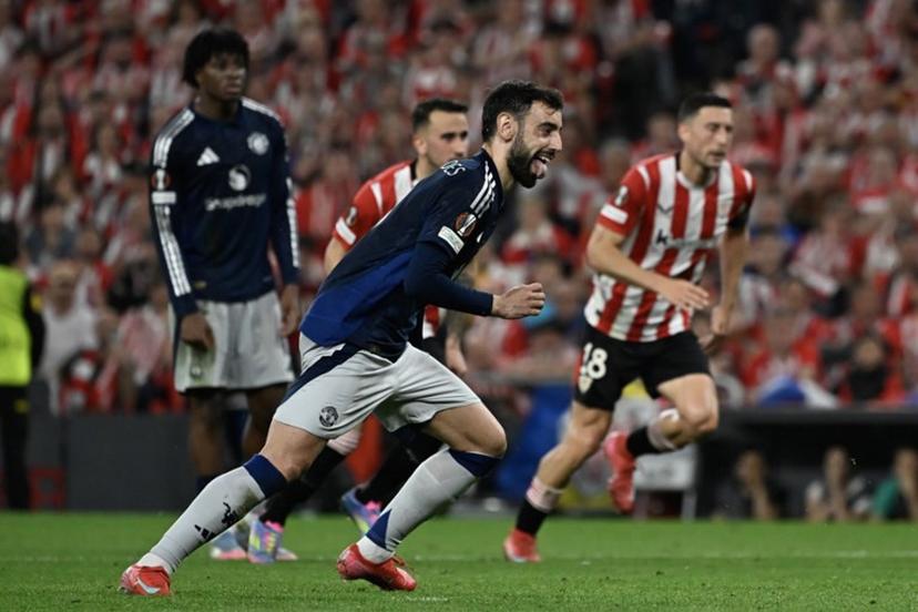 Manchester United's Portuguese midfielder #08 Bruno Fernandes celebrates scoring their second goal during the UEFA Europa League semi final first leg football match between Athletic Club Bilbao and Manchester United at the San Mames stadium in Bilbao, on May 1, 2025.  ANDER GILLENEA / AFP