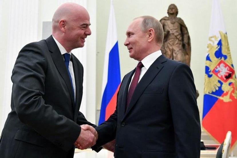 Russian President Vladimir Putin shakes hands with FIFA President Gianni Infantino during a meeting at the Kremlin in Moscow on February 20, 2019.  Yuri KADOBNOV / POOL / AFP