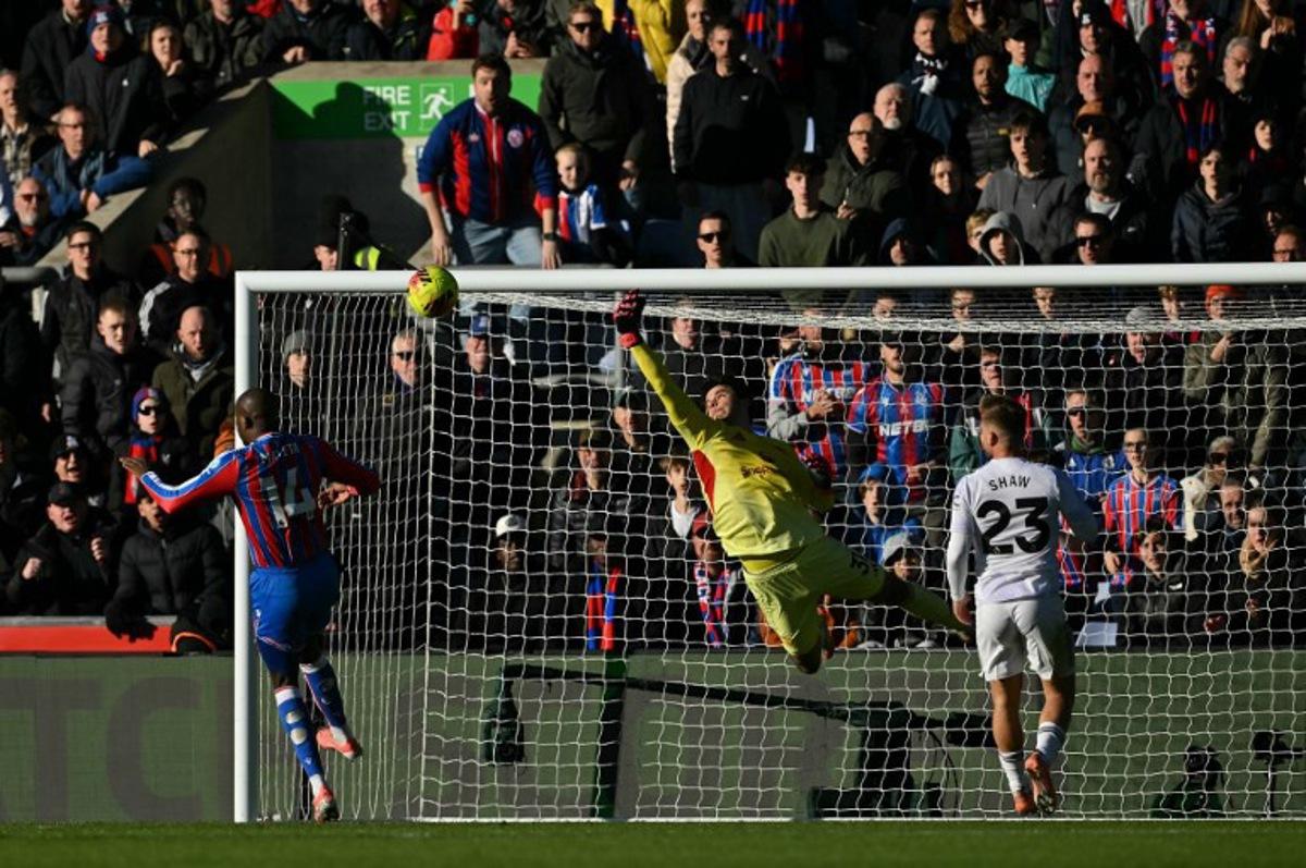 Manchester United's Belgian goalkeeper #31 Senne Lammens makes a save during the English Premier League football match between Crystal Palace and Manchester United at Selhurst Park in south London on November 30, 2025.  Glyn KIRK / AFP