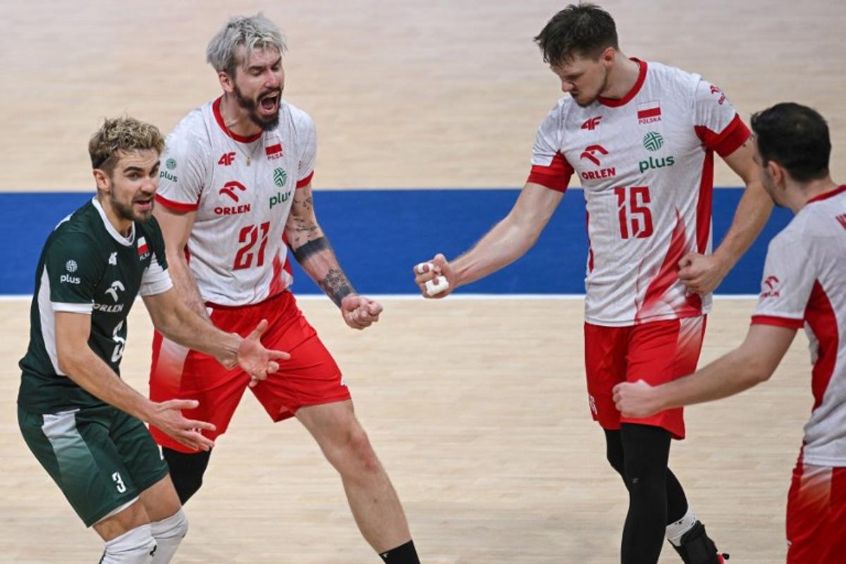 Poland's players celebrate after winning a point during the 2025 Men's Volleyball World Championship third place play-off match between Poland and Czech Republic at the Mall of Asia Arena in Pasay City, Metro Manila on September 28, 2025.  Ted ALJIBE / AFP