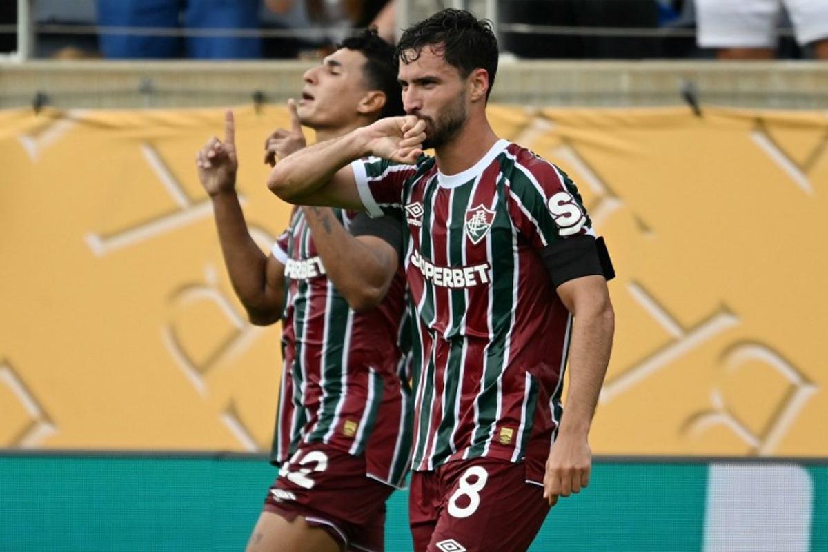 Fluminense's Brazilian midfielder #08 Martinelli celebrates scoring his team's first goal next to Fluminense's Colombian defender #12 Gabriel Fuentesduring the FIFA Club World Cup 2025 quarterfinal football match between Brazil's Fluminense and Saudi Arabia's Al-Hilal at the Camping World Stadium in Orlando on July 4, 2025.  CHANDAN KHANNA / AFP