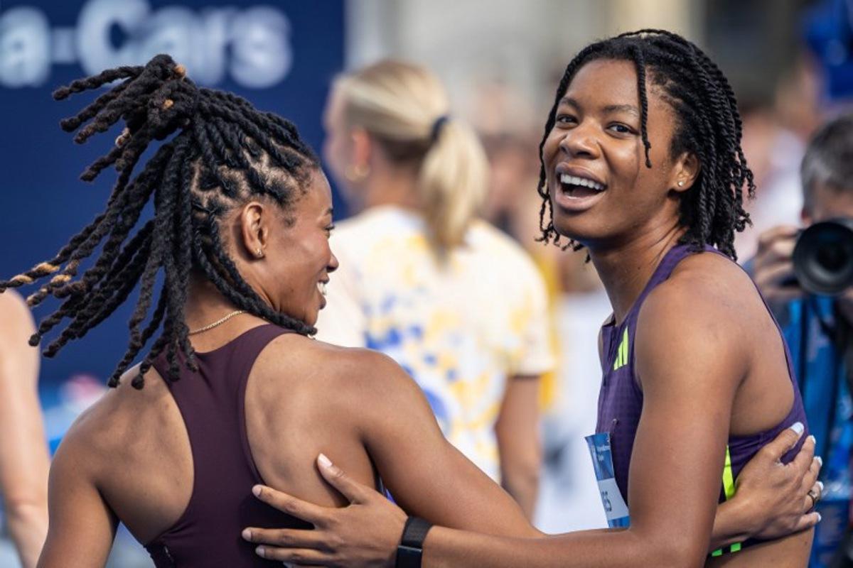 First placed USA's Alyssa Jones (R) and her compatriot, third placed Monae' Nichols celebrate after the women's long jump event of the Silesia Diamond League athletics meeting in Katowice, Poland, on August 22, 2026.  Wojtek RADWANSKI / AFP