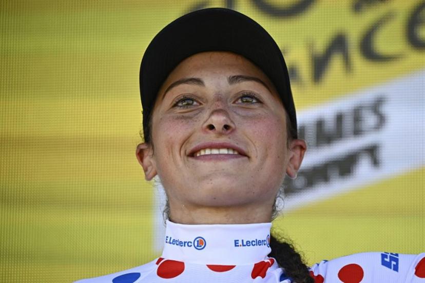 Laboral Kutxa - Fundacion Euskadi team's Italian rider Cristina Tonetti celebrates on the podium with the best climber's polka dot (dotted) jersey after the first stage (out of 8) of the third edition of the Women's Tour de France cycling race, 123 km between Rotterdam and The Hague, on August 12, 2024.   JULIEN DE ROSA / AFP
