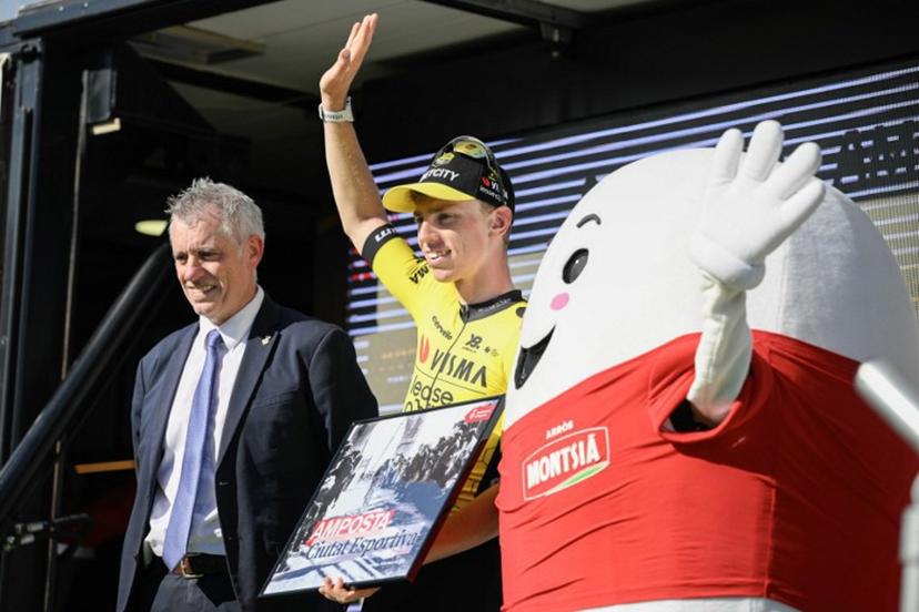Team Visma-Lease a bike's Matthew Brennan celebrates on the podium after winning the 5th stage of the 2025 Volta a Catalunya cycling tour of Catalonia, a 172 km race between Pauls and Amposta, on March 28, 2025.   Josep LAGO / AFP