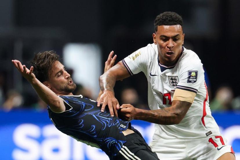 England's midfielder #17 Morgan Rogers (R) and Argentina's defender #03 Nicolas Tagliafico fight for the ball during the 2026 World Cup football tournament semi-final match between England and Argentina at the Atlanta Stadium in Atlanta on July 15, 2026.   Odd ANDERSEN / AFP