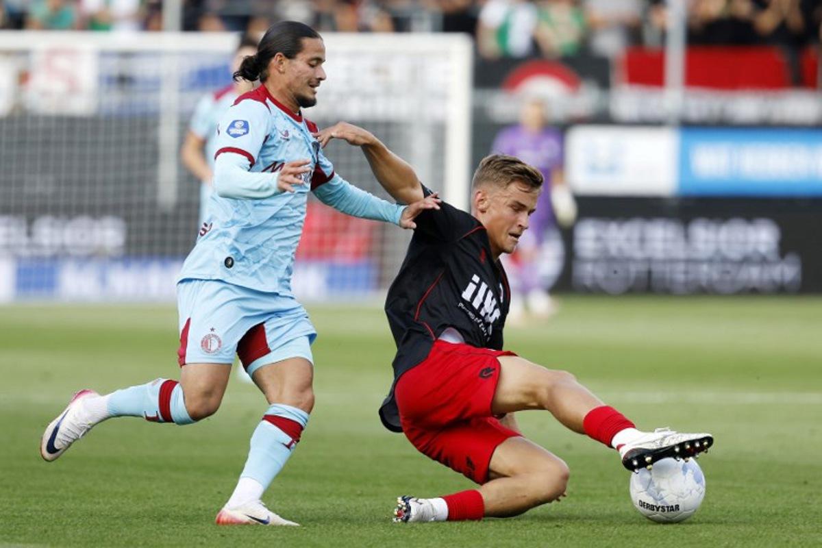 Feyenoord's French forward #23 Anis Hadj Moussa (L) and Excelsior's Swedish defender #04 Casper Widell (R) fight for the ball during the Dutch Eredivisie football match between SBV Excelsior and Feyenoord at the Woudestein Stadium in Rotterdam on August 16, 2025.  Bas Czerwinski / ANP / AFP