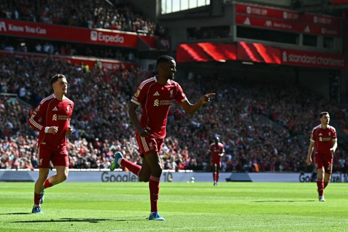 Liverpool's Swedish striker #09 Alexander Isak (C) celebrates scoring the opening goal during the English Premier League football match between Liverpool and Crystal Palace at Anfield in Liverpool, north west England on April 25, 2026.  Paul ELLIS / AFP