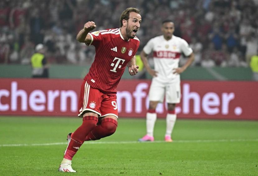 Bayern Munich's English forward #09 Harry Kane celebrates after scoring a penalty during the German Cup (DFB Pokal) final football match FC Bayern Munich v VfB Stuttgart at the Olympic Stadium in Berlin, on May 23, 2026.  Tobias SCHWARZ / AFP