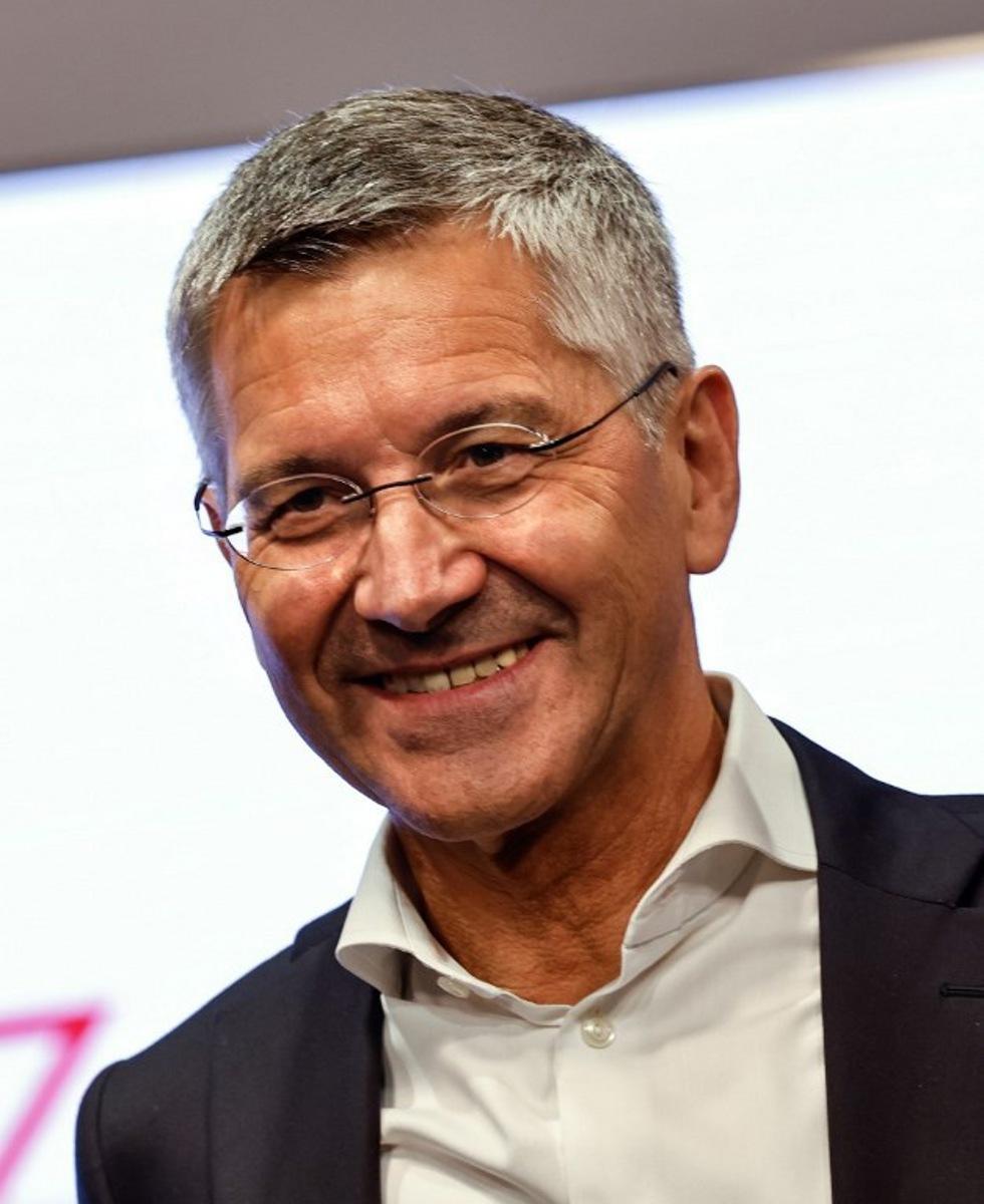 Bayern Munich's President Herbert Hainer smiles during the presentation by German football club FC Bayern Munich of an exhibition about their stadium called "20 Years of Allianz Arena - Castle in the Air, Living Room, Opera Stage", on July 30, 2025 on the stadium compound in Munich.   Alexandra BEIER / AFP