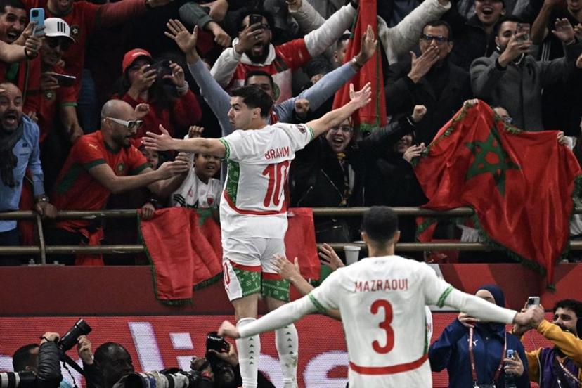 Morocco's forward #10 Brahim Diaz (L) celebrates scoring his team's first goal during the Africa Cup of Nations (CAN) quarter-final football match between Cameroon and Morocco at the Prince Moulay Abdallah stadium in Rabat on January 9, 2026.   Gabriel BOUYS / AFP
