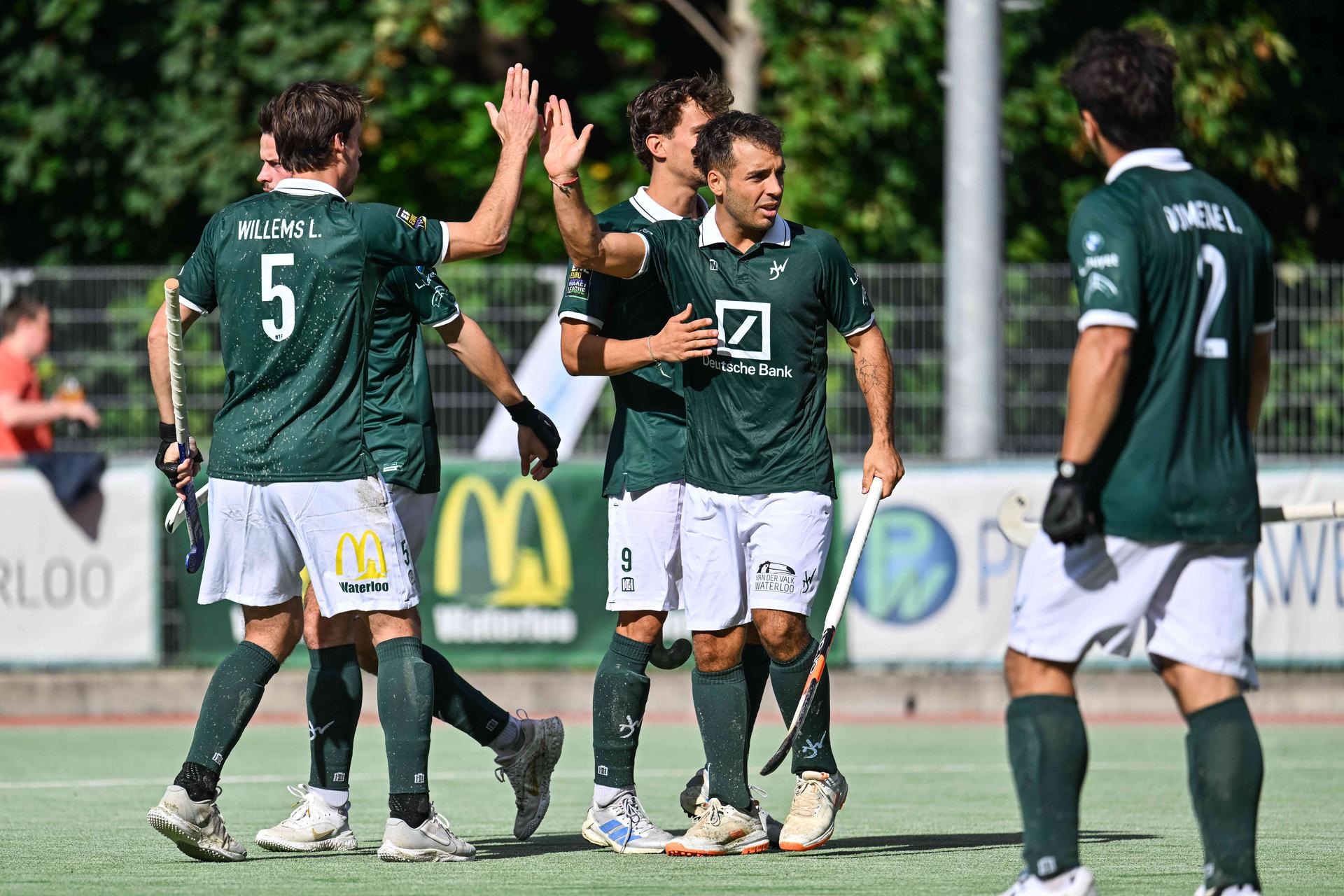 WatDuck's Tomi Domene and WatDucks' players celebrate after scoring during a hockey game between Waterloo Ducks and Braxgata, Sunday 20 September 2026 in Waterloo, on day 1 of the Belgian first division hockey championship.  BELGA PHOTO EMILE WINDAL