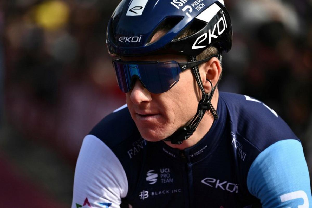 Israel-Premier Tech team's Australian rider Simon Clarke prepares before the 19th one-day classic 'Strade Bianche' (White Roads) cycling race between Siena and Siena, Tuscany, on March 8, 2025.  Marco BERTORELLO / AFP
