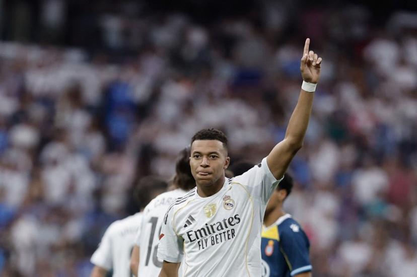 Real Madrid's French forward #10 Kylian Mbappe celebrates after scoring their second goal during the Spanish league football match between Real Madrid CF and RCD Espanyol at the Santiago Bernabeu stadium in Madrid on September 20, 2025.  Oscar DEL POZO / AFP