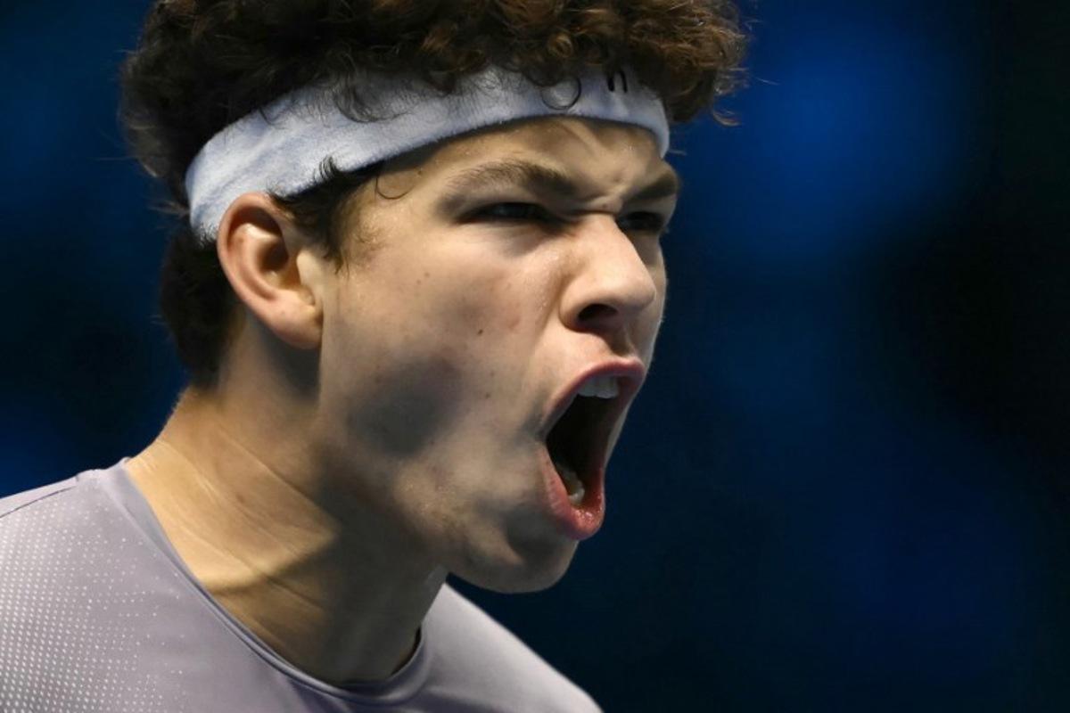 USA's Ben Shelton reacts during his match against Canada's Felix Auger-Aliassime at the ATP Finals tennis tournament in Turin on November 12, 2025.  Marco BERTORELLO / AFP