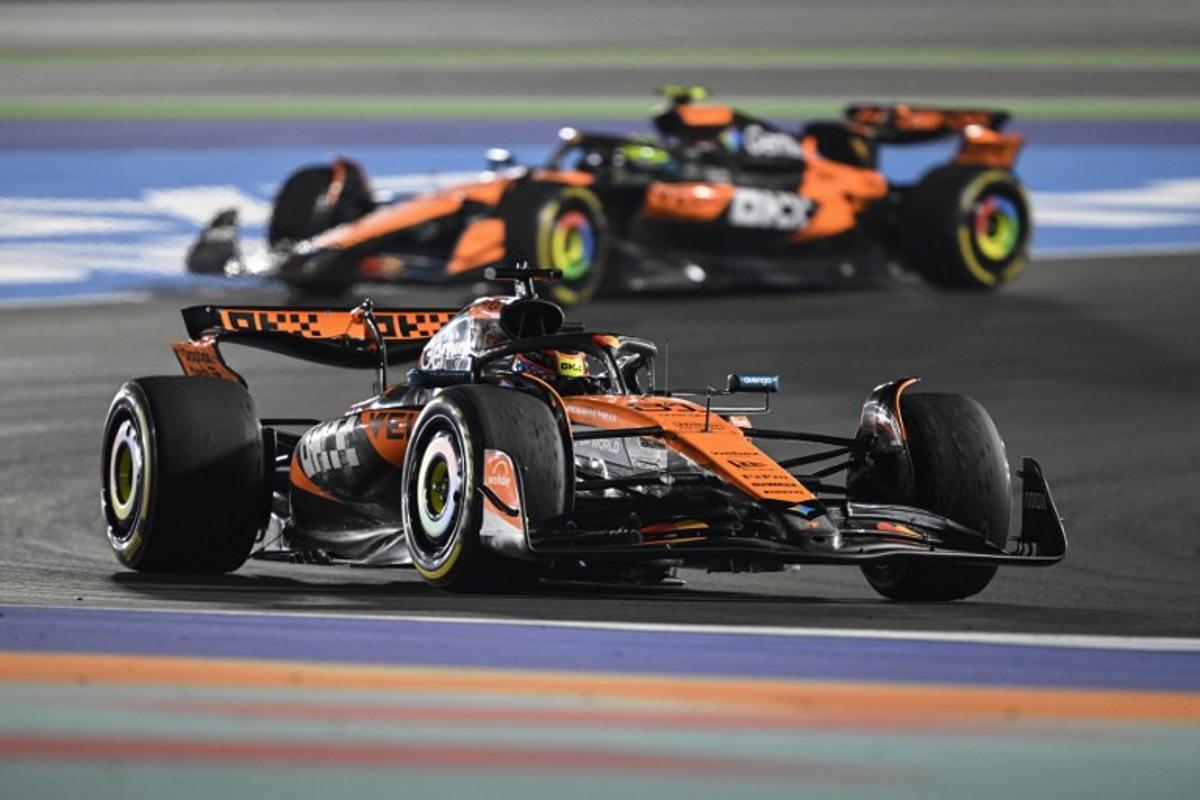 McLaren's Australian driver Oscar Piastri and McLaren's British driver Lando Norris drive during the sprint race ahead of the Formula One Qatar Grand Prix at the Lusail International Circuit in Lusail on November 29, 2025.  Mahmud HAMS / AFP