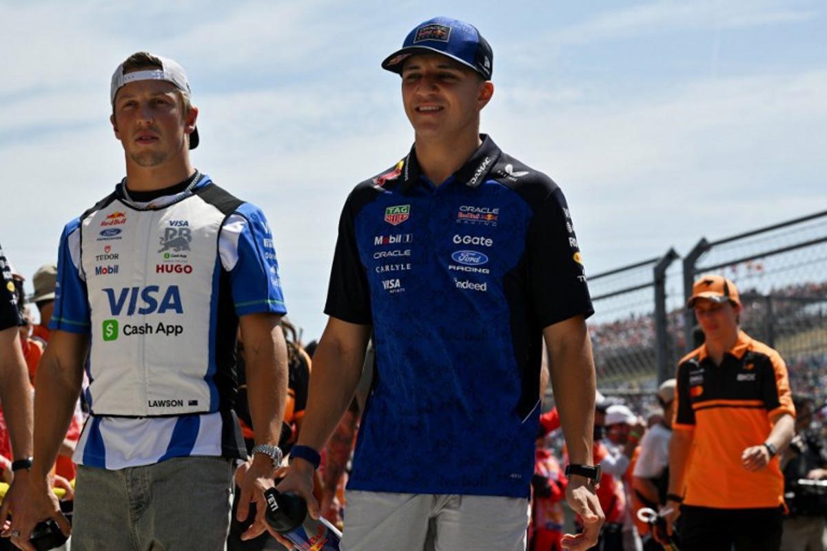 (From L) Racing Bulls' New Zealand driver Liam Lawson and Red Bull Racing's French driver Isack Hadjar arrive prior to the Formula One Hungarian Grand Prix at the Hungaroring racetrack in Mogyorod near Budapest, Hungary, on July 26, 2026.  Andrej ISAKOVIC / AFP