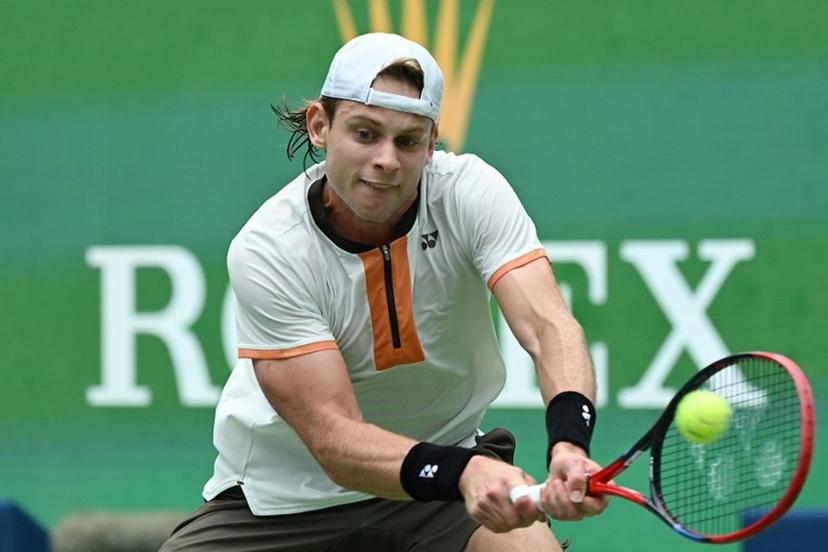 Belgium's Zizou Bergs hits a return to Canada's Gabriel Diallo during their men's singles match at the Shanghai Masters tennis tournament in Shanghai on October 7, 2025.  Jade Gao / AFP