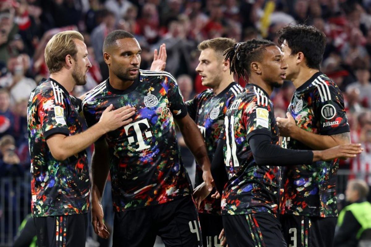 Bayern Munich's English forward #09 Harry Kane (L) celebrates scoring his team's fourth goal with teammates during the German first division Bundesliga football match between FC Bayern Munich and Union Berlin in Munich, southern Germany on September 18, 2026.  Alexandra BEIER / AFP