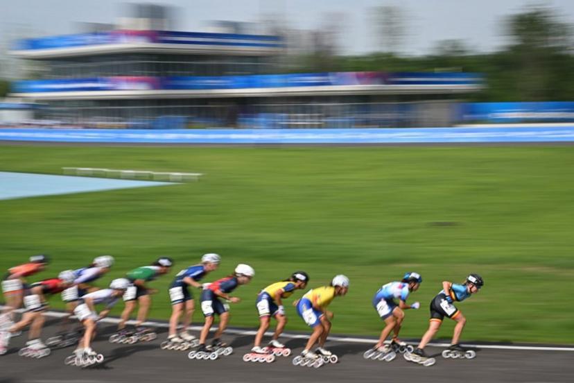 Belgium's Jorun Geerts (1st-R) competes in the women's 100m speed skating road sprint semifinal during the 2025 World Games at the Shuyue Park in Chengdu, in China's southwestern Sichuan province on August 13, 2025.   JADE GAO / AFP
