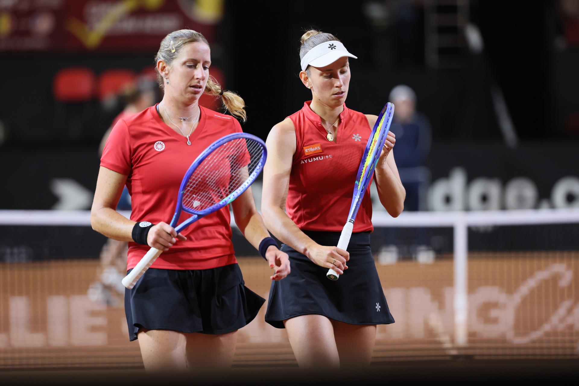 Belgian Magali Kempen and Belgian Greet Minnen pictured during the third game, a double game between Belgian pair Kempen/ Minnen and US pair McNally/ Melichar on the second day of the qualifiers of the Billie Jean King Cup tennis between Belgium and the USA, in Oostende, Belgium, on . The meeting takes place on 10 and 11th April. PHOTO BENOIT DOPPAGNE