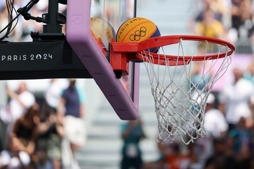 The basketball is seen on the hoop in the women's pool round 3x3 basketball game between Azerbaijan and France during the Paris 2024 Olympic Games at La Concorde in Paris on August 1, 2024.  David GRAY / AFP