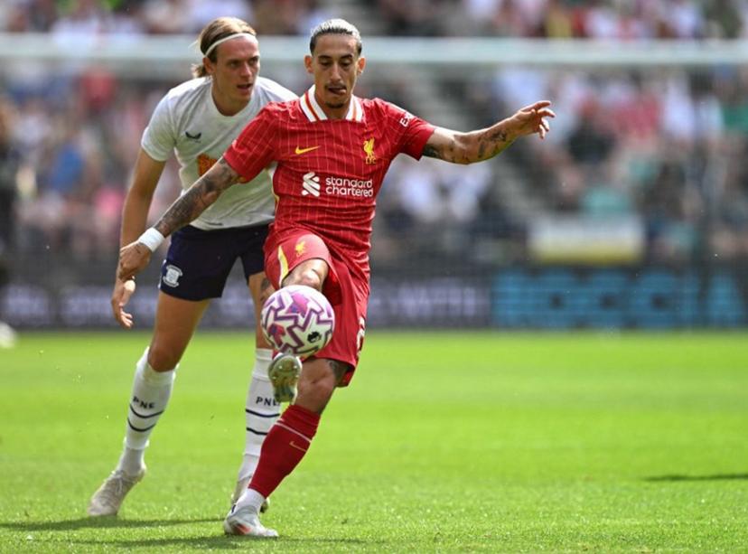 Liverpool's Greek defender #21 Kostas Tsimikas controls the ball during the pre-season friendly football match between Preston North End and Liverpool at Deepdale stadium in Preston, north-west England on July 13, 2025. Liverpool are to retire Diogo Jota's number 20 shirt in honour of the Portugal forward who was killed in a car crash this month. The club return to action for the first time since the July 3 tragedy at English Championship side Preston today. Oli SCARFF / AFP