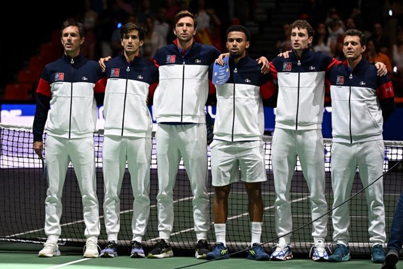 (From L) France's Edouard Roger-Vasselin, France's Pierre-Hugues Herbert, France's Arthur Rinderknech, France's Arthur Fils, France's Ugo Humbert and France's Paul-Henri Mathieu line up before the group stage men's singles match between France and Spain of the Davis Cup tennis tournament at the Fuente San Luis Sports Hall in Valencia on September 13, 2024.  Jose Jordan / AFP