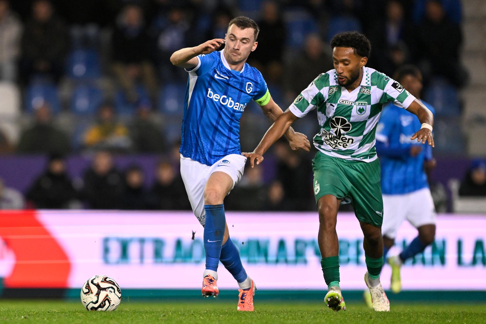 Genk's Bryan Heynen and RAAL's Samuel Gueulette fight for the ball during a soccer match between KRC Genk and RAAL La Louviere, Sunday 26 October 2025 in Genk, a game of day 12 of the 2025-2026 'Jupiler Pro League' first division of the Belgian championship. BELGA PHOTO JOHAN EYCKENS