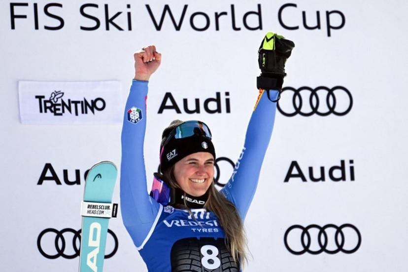Italy's Laura Pirovano celebrates on the podium after winning the Women's Downhill race of the FIS Ski World Cup at the La Volata slope in the Passo San Pellegrino ski area, Val di Fassa, Italy on March 6, 2026.  Andreas SOLARO / AFP