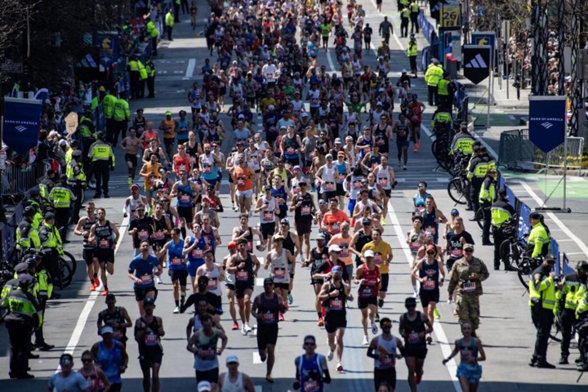 Runners make their way down Boylston Street as they compete in the 129th Boston Marathon on April 21, 2025, in Boston, Massachusetts.  The marathon includes around 30,000 athletes from 129 countries running the 26.2 miles from Hopkinton to Boston, Massachusetts.  The event is the world's oldest annually run marathon.  Joseph Prezioso / AFP