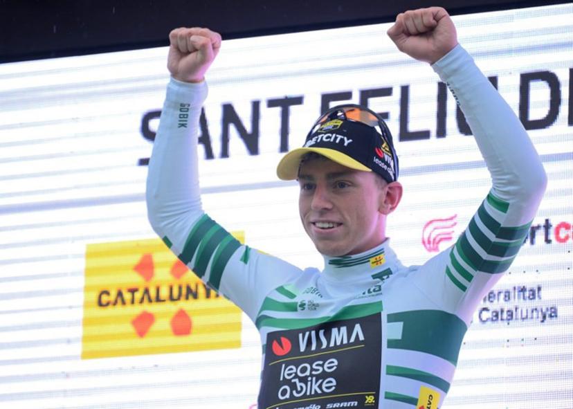 Stage winner Team Visma's British rider James Matthew Brennan celebrates on the podium of the first stage of the 2025 Volta a Catalonya cycling tour of Catalonya, a 178,3 km loop starting and finishing in Sant Feliu de Guixols, on March 24, 2025.  Josep LAGO / AFP