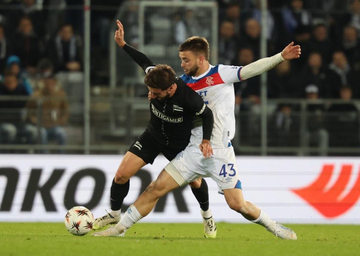 Sturm Graz's Georgian midfielder #10 Otar Kiteishvili and Glasgow Rangers' Belgian midfielder #43 Nicolas Raskin vie for the ball during the UEFA Europa League first round day 2 football match Sturm Graz v Glasgow Rangers in Graz, Austria, on October 2, 2025.  ERWIN SCHERIAU / APA / AFP