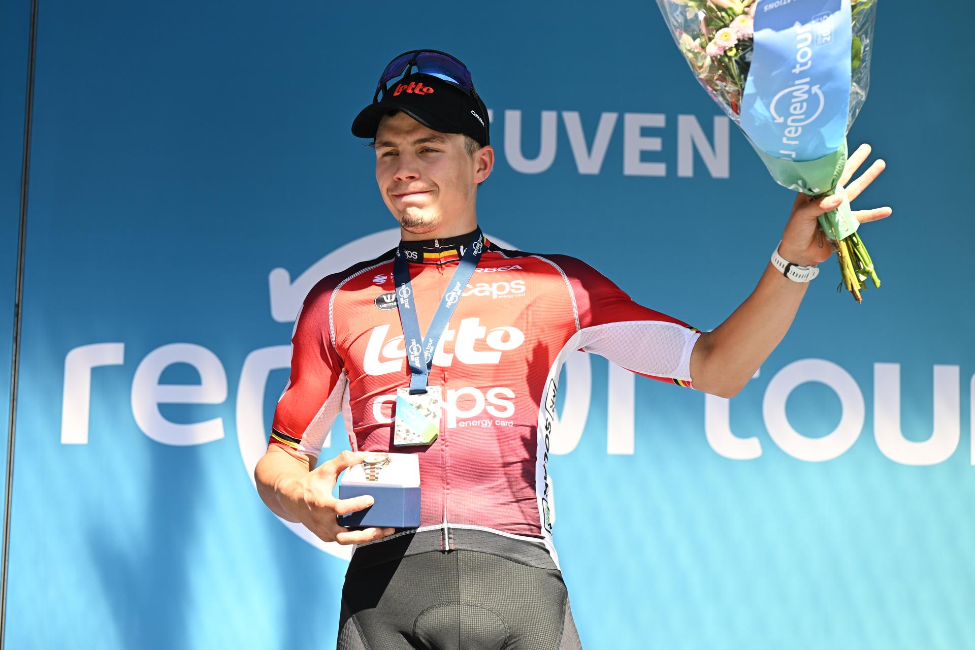 Belgian Arnaud De Lie of Lotto Cycling Team celebrates on the podium after winning the fifth and last stage of the 'Renewi Tour' multi-stage cycling race, 185km from and to Leuven on Sunday 24 August 2025. The five-day race takes place in Belgium and the Netherlands.  BELGA PHOTO DAVID PINTENS