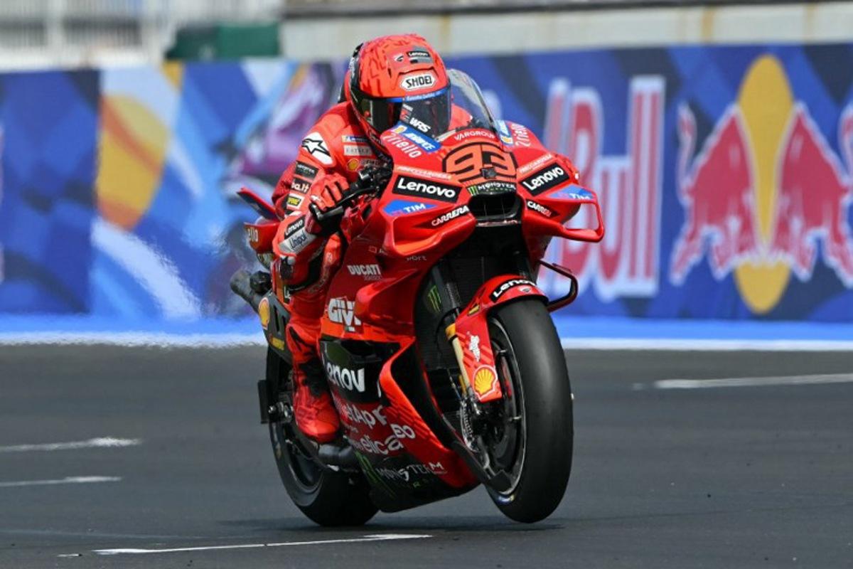 Ducati Lenovo Team's Spanish MotoGP rider Marc Marquez accelerates down the straight as he leads the San Marino Moto GP Grand Prix at the Misano World Circuit Marco Simoncelli, in Misano Adriatico, northern Italy, on September 14, 2025.  Andreas SOLARO / AFP