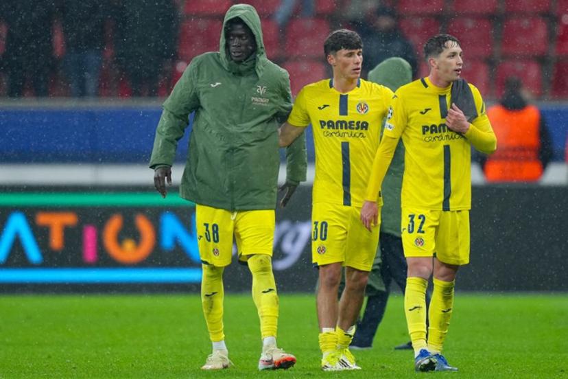 Villarreal's Senegalese midfielder #38 Alassane Diatta, Villarreal's Spanish defender #30 Daniel Budesca and Villarreal's Spanish midfielder #32 Hugo Lopez react at the end of the UEFA Champions League league phase - Day 8 football match between Bayer Leverkusen and Villarreal CF at the BayArena stadium in Leverkusen, western Germany on January 28, 2026.  Pau Barrena / AFP