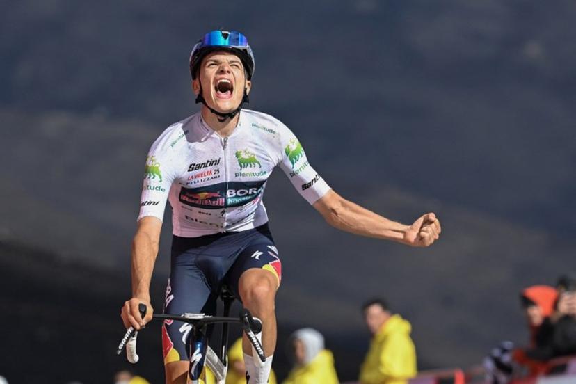 Team Bora's Italian rider Giulio Pellizzari celebrates as he crosses the finish line to win the 17th stage of the Vuelta a Espana, a 143 km race between  O Barco de Valdeorras and Alto de El Morredero, Ponferrada, on September 10, 2025.    Miguel RIOPA / AFP