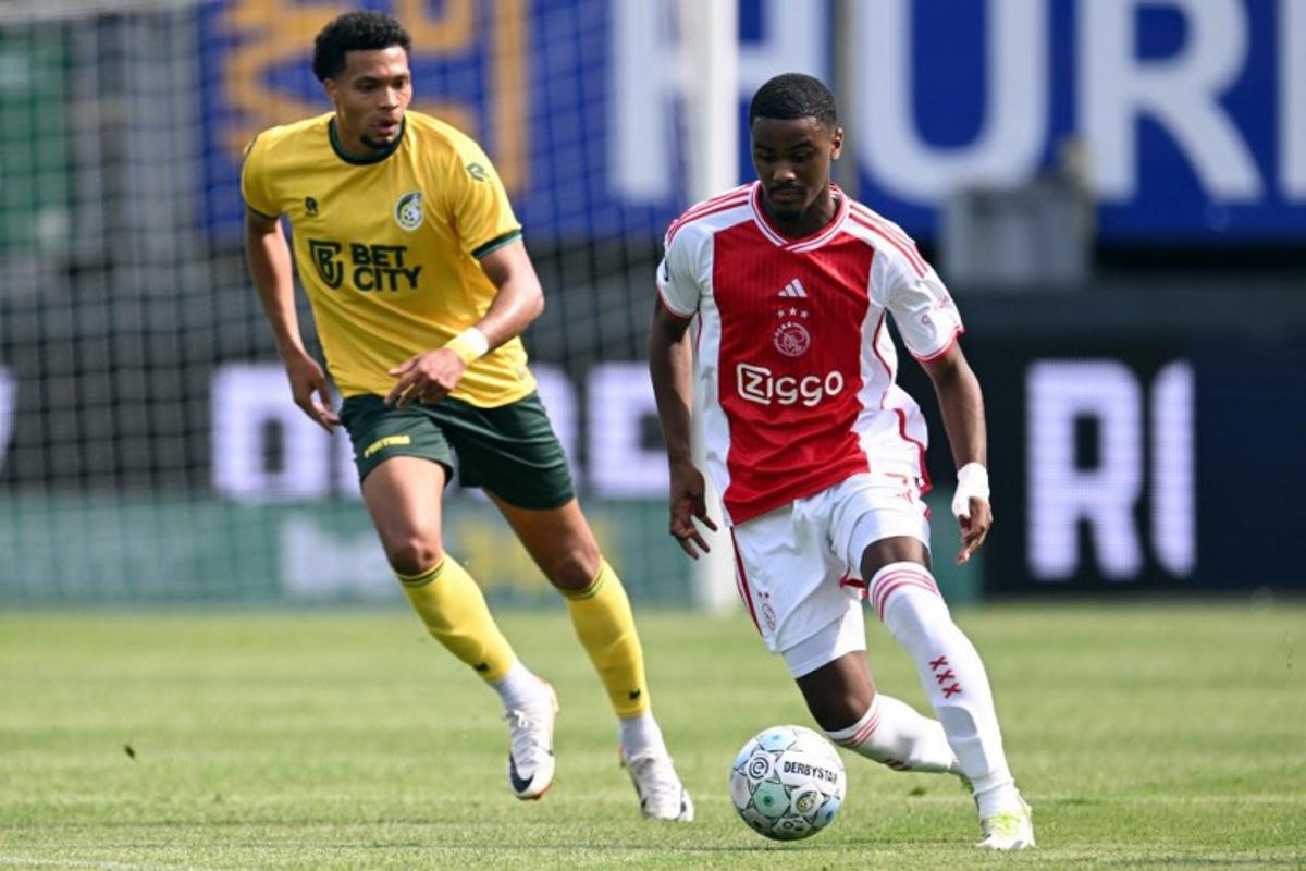 Ajax's defender Jorrel Hato controls the ball next to Fortuna Sittard's Algerian forward  Mouhamed Belkheir during the Dutch Eredivisie match between Fortuna Sittard and Ajax at the Fortuna Sittard Stadium in Sittard on September 3, 2023.  Gerrit van Keulen / ANP / AFP