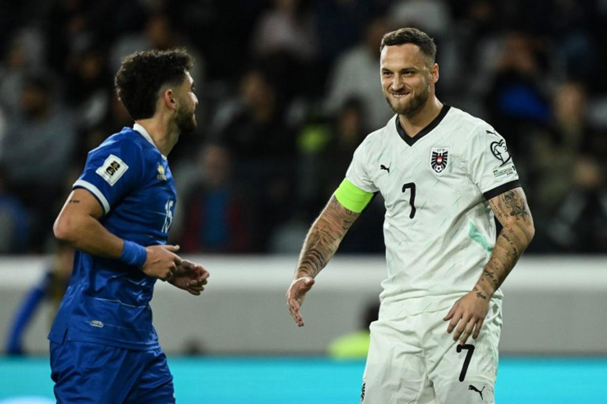 Austria's forward #07 Marko Arnautovic (R) reacts after scoring his team's first goal from the penalty spot during the FIFA World Cup 2026 European qualification football match between Cyprus and Austria at the Alphamega Stadium, on the outskirts of Limassol, on November 15, 2025.  Jewel SAMAD / AFP