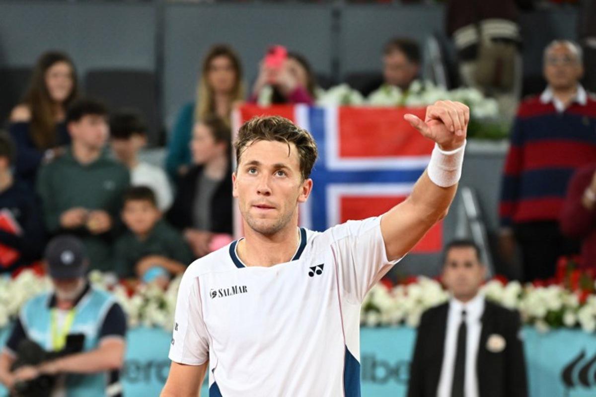 Norway's Casper Ruud celebrates after winning to Argentina's Francisco Cerundolo during their 2025 ATP Tour Madrid Open tennis tournament semi-final singles match at the Caja Magica in Madrid, on May 2, 2025.   JAVIER SORIANO / AFP