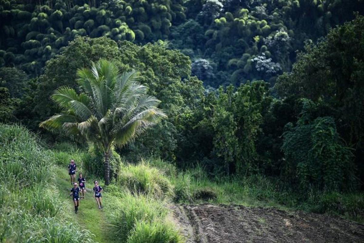 Participants compete in an orienteering race in Saint Pierre as part of the Raid des Alizes exclusively all-female multi sport competition in the French Caribbean island of Martinique on November 27, 2021.   Each team represent a charity project of their choice during the competition. According to the final ranking, donations will be directly processed in favor of the represented associations. Anne-Christine POUJOULAT / AFP