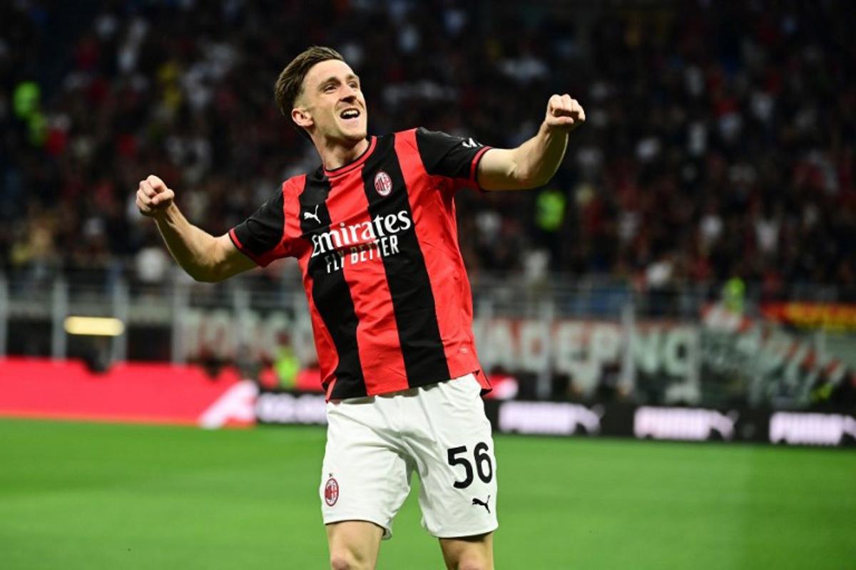 AC Milan's Belgian midfielder #56 Alexis Saelemaekers celebrates after scoring his team's first goal during the Italian Serie A football match between AC Milan and Cagliari at the San Siro Stadium in Milan on May 24, 2026.  Piero CRUCIATTI / AFP