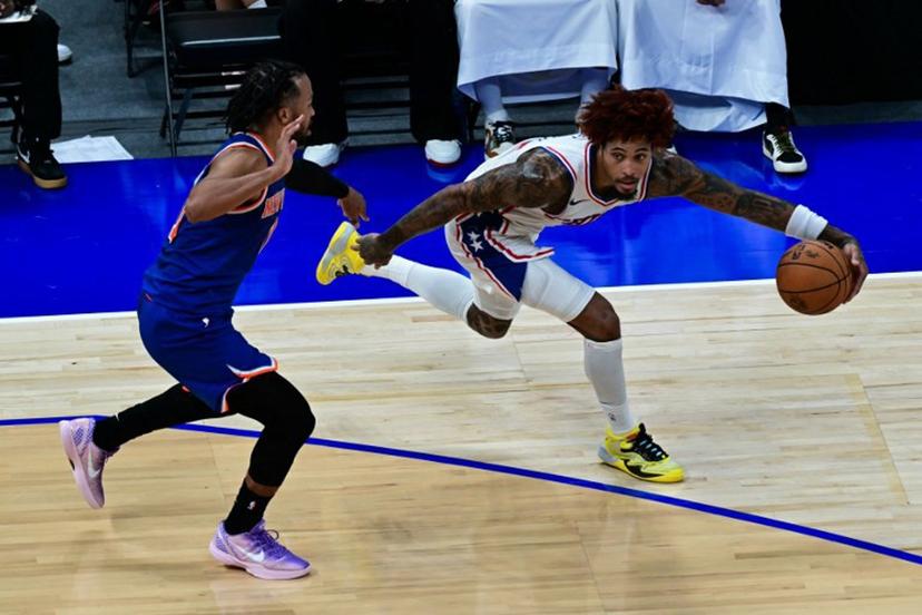 Philadelphia 76ers' #09 Kelly Oubre Jr. (R) dribbles against New York Knicks' #11 Jalen Brunson during the NBA basketball game between the New York Knicks and the Philadelphia 76ers at the Etihad Arena in Abu Dhabi on October 4, 2025.  Giuseppe CACACE / AFP