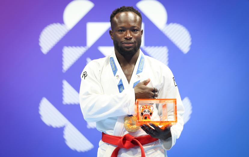 Belgian Florian Bayili  celebrates on the podium as he won the gold medal after a fight with United Arab Emirates' Alsuwaidi, the final game in the Ju-Jitsu Men's -69kg Ne-Waza competition during the World Games 2025, in Chenghdu, China, on Monday 11 August 2025. This year, the World Games take place from 07 to 17 augustus. BELGA PHOTO VIRGINIE LEFOUR
