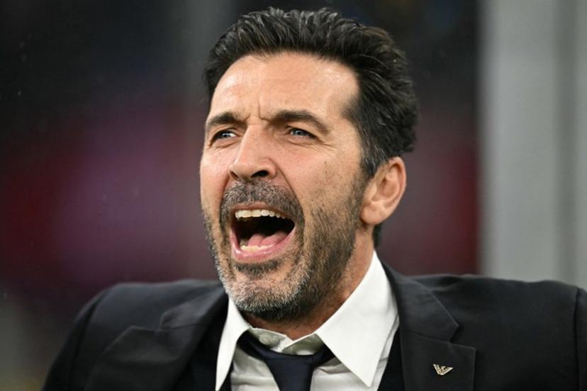 Former goalkeeper Gianluigi Buffon sing the national anthem before the FIFA World Cup 2026 European qualification football match between Italy and Norway, at the San Siro Stadium, in Milan, on November 16, 2025.     Stefano RELLANDINI / AFP