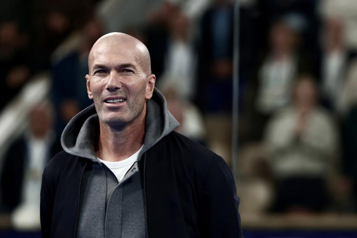 French football legend and coach Zinedine Zidane attends the podium ceremony of the women's Paris Major Premier Padel tournament after the final match on Court Philippe-Chatrier at the Roland-Garros Complex in Paris on September 14, 2025.  Thibaud MORITZ / AFP