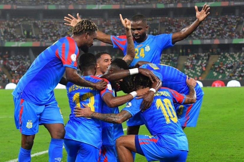 DR Congo's defender #22 Chancel Mbemba (C) celebrates with teammates after scoring his team's first goal during the Africa Cup of Nations (CAN) 2024 quarter-final football match between DR Congo and Guinea at the Alassane Ouattara Stadium in Ebimpe, Abidjan on February 2, 2024.  SIA KAMBOU / AFP