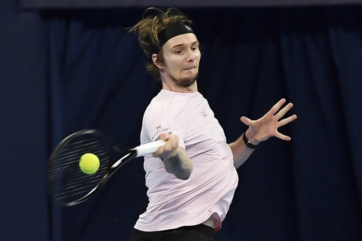 Kazakhstan's Alexander Bublik hits a return to China's Wu Yibing during their men's singles semi-final match at the Hangzhou Open tennis tournament in Hangzhou, in China's eastern Zhejiang province on September 22, 2025.  STR / AFP