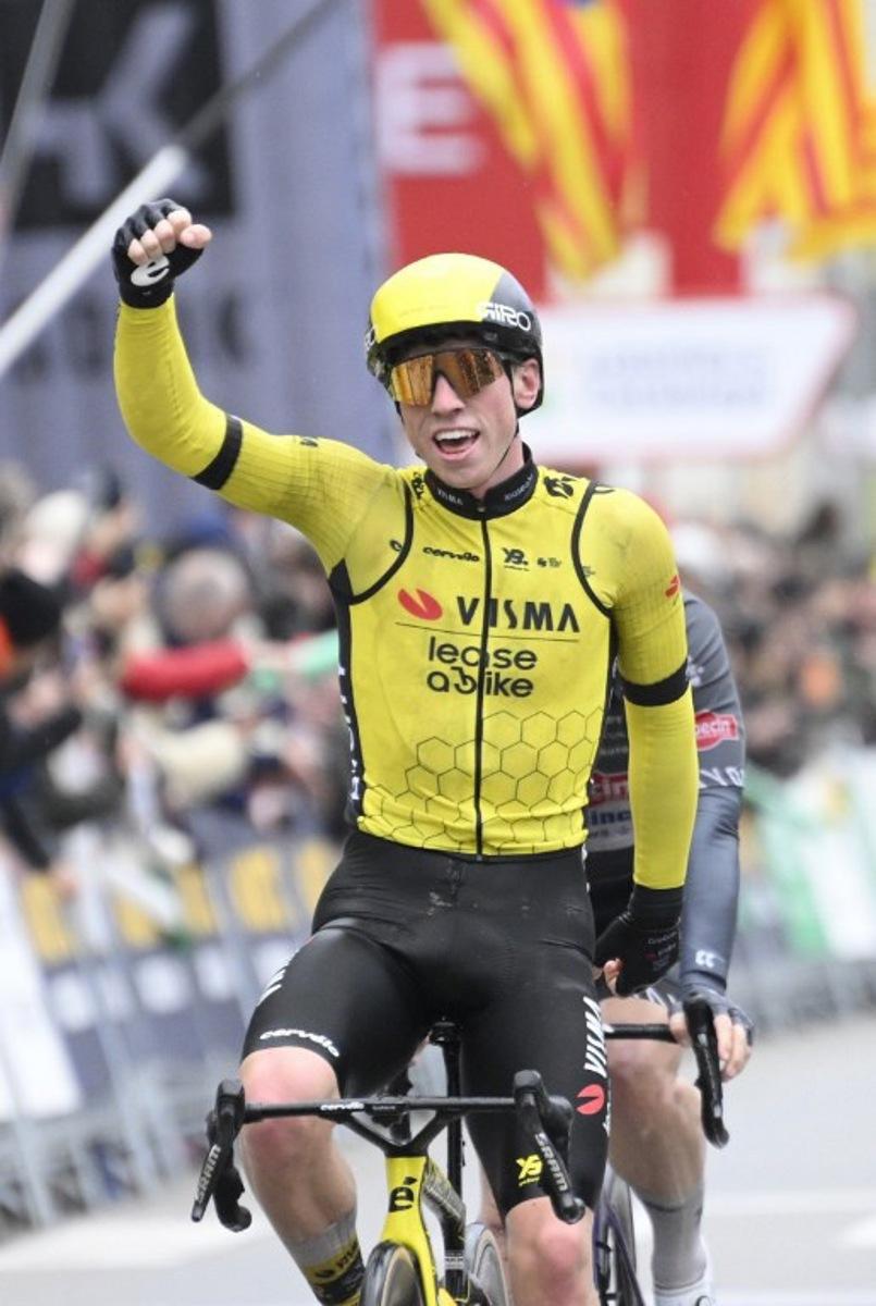Team Visma's British rider James Matthew Brennan (L) celebrates crossing first the finish line ahead of Team Alpecin's Kaden Groves at the end of the first stage of the 2025 Volta a Catalonya cycling tour of Catalonya, a 178,3 km loop starting and finishing in Sant Feliu de Guixols, on March 24, 2025.  Josep LAGO / AFP