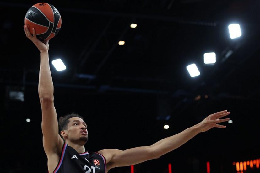 Paris Basketball's Belgian pivot #21 Ismael Bako holds the ball during the Euroleague basketball match between Paris Basketball and Virtus Bologna at the Adidas Arena, in Paris, on October 9, 2025.  Anne-Christine POUJOULAT / AFP