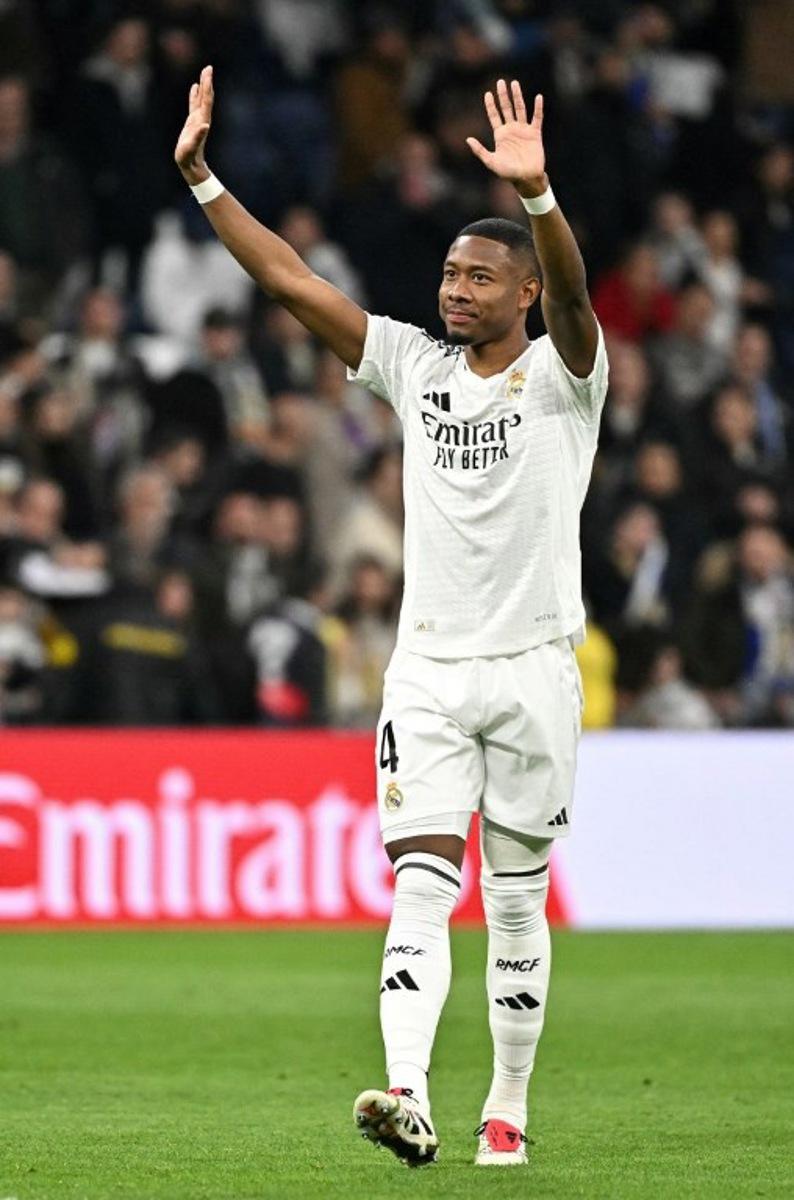 Real Madrid's Austrian defender #04 David Alaba back from injury salutes at the end of the Spanish league football match between Real Madrid CF and UD Las Palmas at the Santiago Bernabeu stadium in Madrid on January 19, 2025.  JAVIER SORIANO / AFP